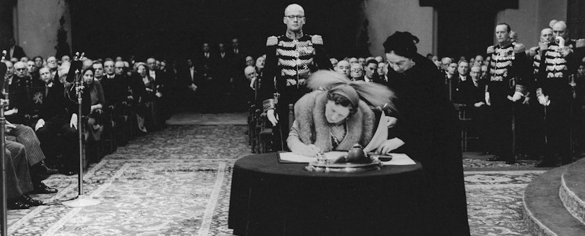 Queen Juliana signing the Charter for the Kingdom of the Netherlands
